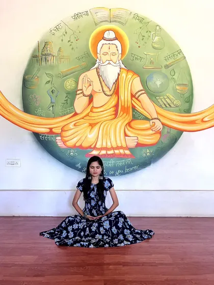 A closer look at the details of the rishi mural. Every element in the background circle represents a different aspect of knowledge and spirituality, painted to create a powerful meditative focus.