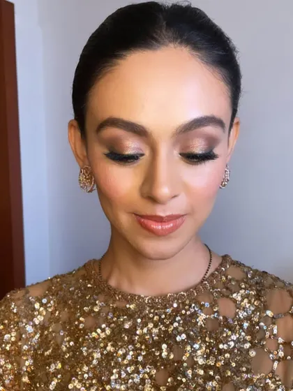 The eyes truly are the focus here. This is a perfect example of a soft glam eye makeup for a reception.