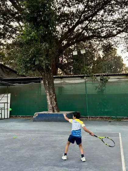 A junior player practices his backhand, showing the dedication that is built on our courts.