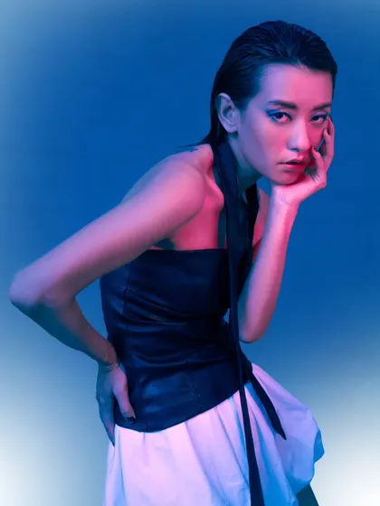 A full-body pose showcasing a contemporary look with dramatic, colorful lighting. This style adds a dynamic and modern flair to any portfolio.