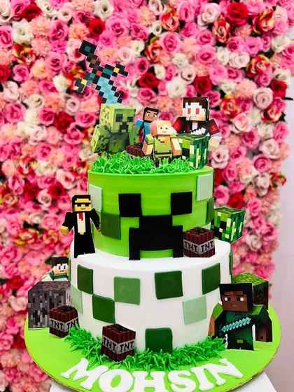 For the gamers, I created this intricate, multi-tiered Minecraft cake. It features the iconic pixelated blocks, Creepers, and other characters, all made from fondant.