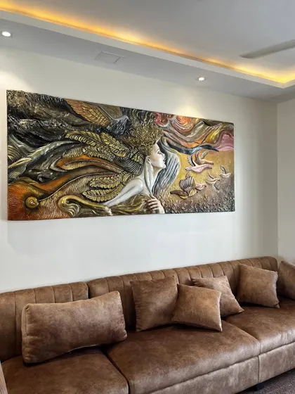 The mural installed and viewed from the side, showing how it commands the space as a central piece of art.