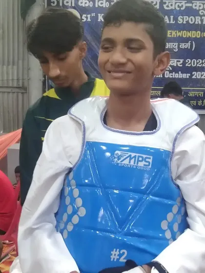 My student, all smiles after a tough match. The joy of competing is what matters.