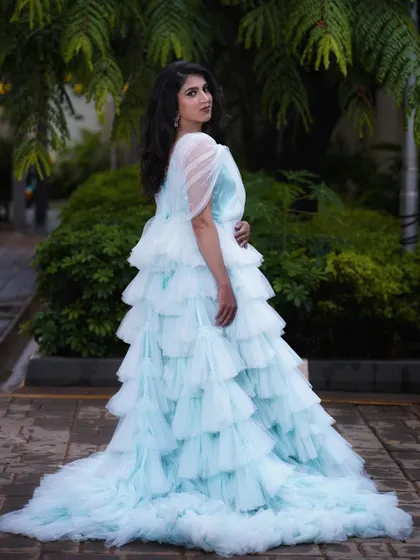 A full-length view of this ethereal look, featuring a stunning tiered teal gown. I kept the makeup soft and romantic to match the dreamy quality of the dress.