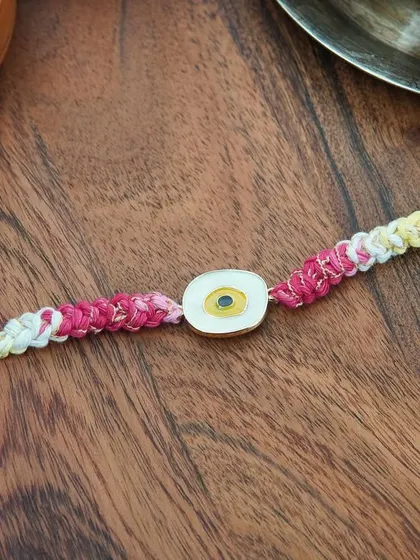 My yellow Evil Eye Rakhi. A bright and cheerful way to send good vibes and protection.