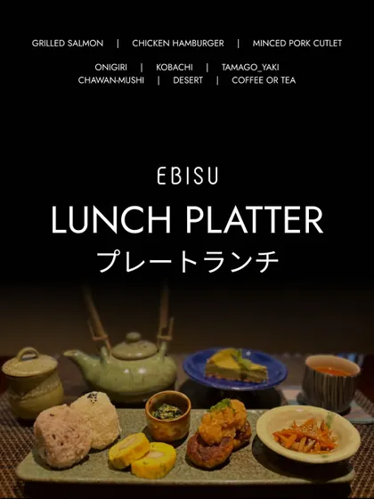 Our Lunch Platter offers a complete and balanced meal. It includes a main like grilled salmon or chicken hamburger, along with onigiri, tamago-yaki, and other small side dishes.
