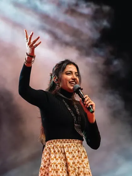 Interacting with the audience during the 'Suggi Huggi' festival. It's always fun to share a laugh and a song with everyone.