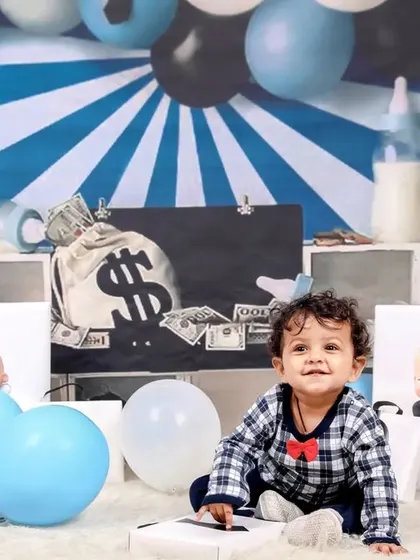 Another variation of the 'Boss Baby' theme, with a slightly different arrangement of props but the same adorable and commanding attitude.