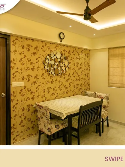 A classic dining room setup with a floral wallpaper that adds character. The design is simple, functional, and perfect for daily family meals.