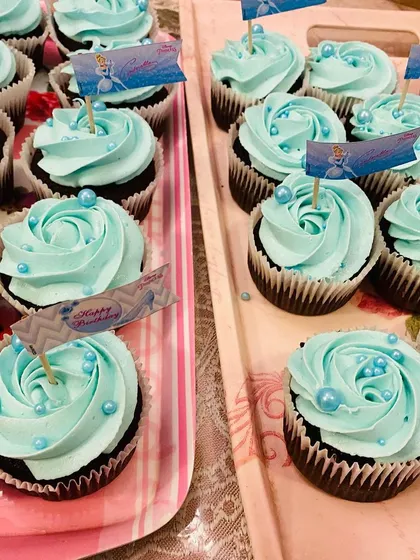 Trays of my Cinderella themed chocolate cupcakes with blue vanilla buttercream, ready for a princess birthday party.