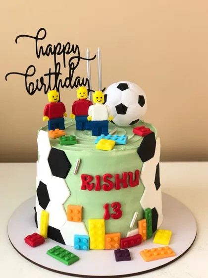 A creative cake combining two favorites: LEGO and football. This design is perfect for a teen's birthday celebration.