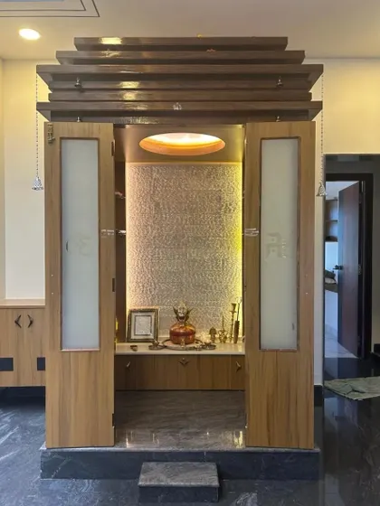 A duplicate of image 124, showing the full view of the modern pooja unit with its tiered wooden top.