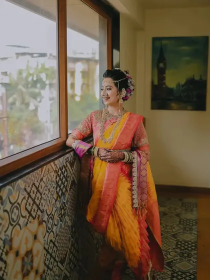 A thoughtful portrait of the bride looking out a window, using natural light to create a soft and elegant image.