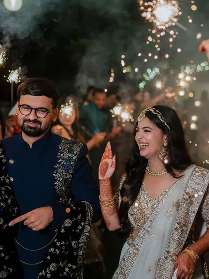 A lively entrance with friends and sparklers. We capture the collective joy and celebration of your Sangeet night, creating images that are full of energy and happiness.