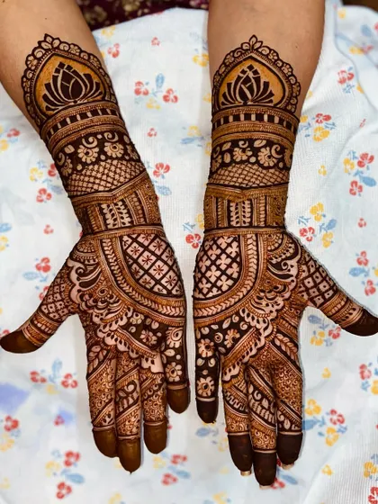 A graceful design with a prominent lotus cuff at the wrist and a combination of net and floral patterns on the palm.