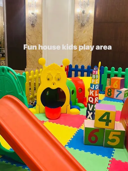 A close-up of the rainbow setup, showing the caterpillar tunnel and colorful numbered blocks for learning and play.