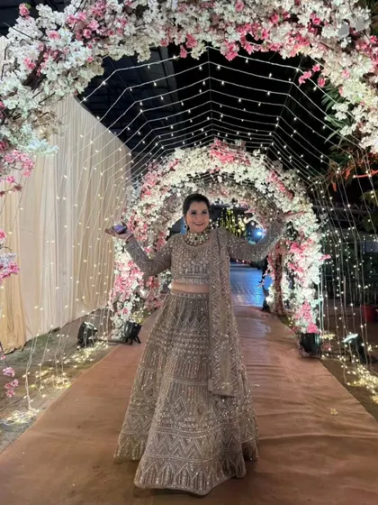 Our client looks like she's walking on a cloud in this gorgeous embellished beige lehenga. The perfect outfit for a magical evening.