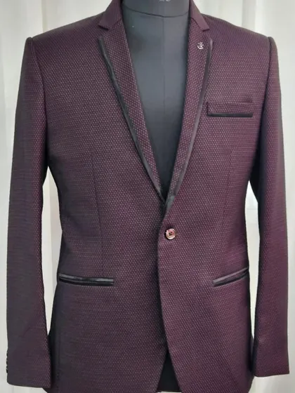 A textured maroon blazer, perfect for pairing with one of our gowns for a coordinated couple's look.