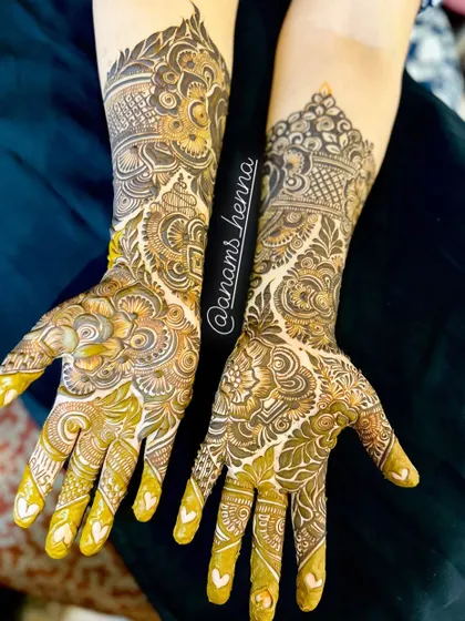 Another angle of the same beautiful bridal mehndi. The symmetry and attention to detail are key to creating a perfect bridal look.
