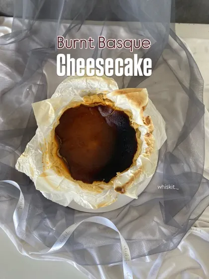 My Burnt Basque Cheesecake, with its signature rustic, caramelized top. It's intentionally burnt to create a deep, complex flavor that contrasts with the creamy interior.
