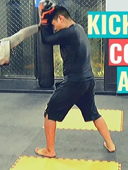 A kickboxing counter-attack in action. Here, I'm demonstrating how to block a punch and immediately return with a head kick. Timing is everything in striking.