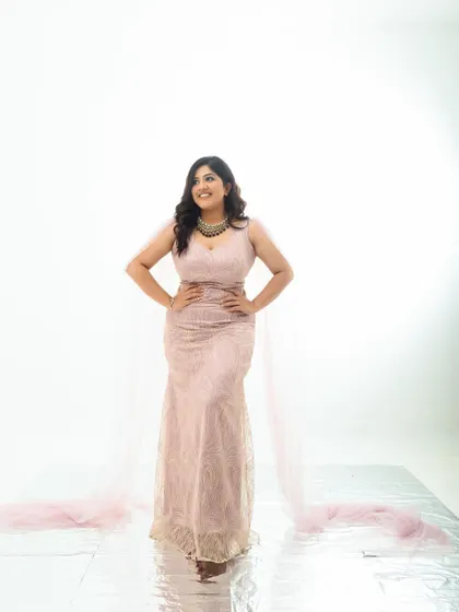 Another powerful, confident pose in the pink gown. The series shows a range of moods, all in the same beautiful outfit.