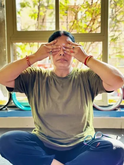 A student practices Bhramari Pranayama (Bee Breath), a calming technique that soothes the nervous system.