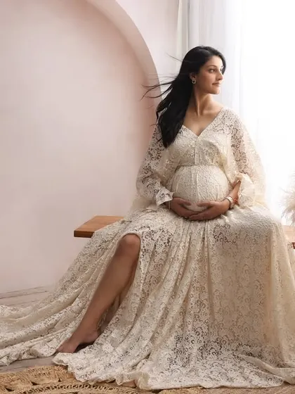 This is the essence of the motherhood glow I love to capture. In the quiet comfort of my studio, we used soft, natural light and a beautiful lace gown to create this timeless and serene portrait.