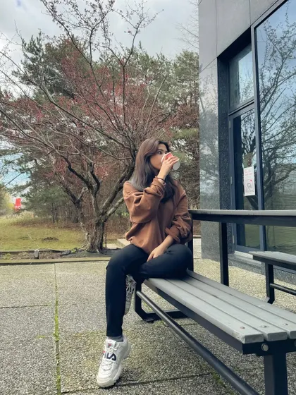 Enjoying a moment of peace after exams in my simple and comfortable outfit.