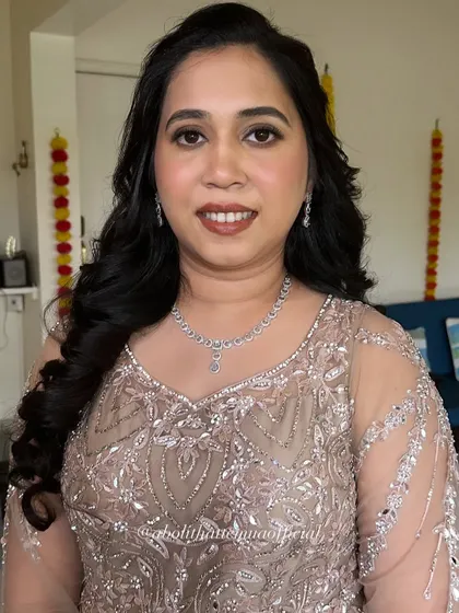 A closer view of the makeup for this elegant party look. The focus is on clean skin, defined brows, and a warm, neutral lip color.