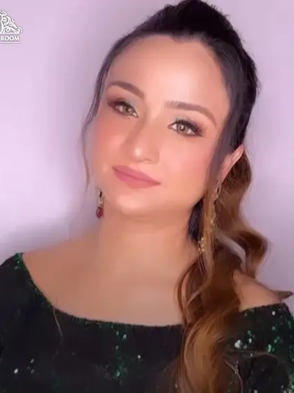 A smiling shot of the client, showing how confident and happy she feels with her makeup.