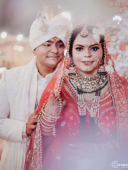 A lovely portrait of the couple, with the groom looking lovingly at his bride. The soft focus adds a dreamy quality to the image.