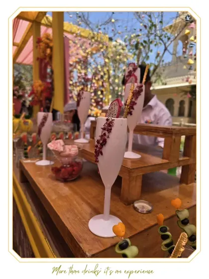 An artfully presented cocktail with a dragon fruit garnish and custom stirrer. These details elevate the drink and enhance the visual appeal of the bar.