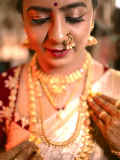 A detailed close-up of a bride's jewelry on her wedding day. I pay close attention to capturing the intricate details of the bridal look, from the nose ring to the necklace.