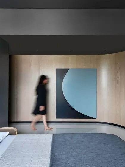 A dynamic shot of the second son's bedroom, where a long, curving veneered wall guides you into the space.
