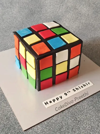 Is it a Rubik's Cube or a cake? This chocolate truffle cake is designed to look exactly like the classic puzzle toy, with each colored square individually cut and placed.