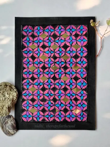 Part of my 'Rann ke Rang' series, this A5 piece is inspired by the mirror work of Kutch, Gujarat. The geometric pattern is hand-painted in bright pink and blue with small mirrors that catch the light.