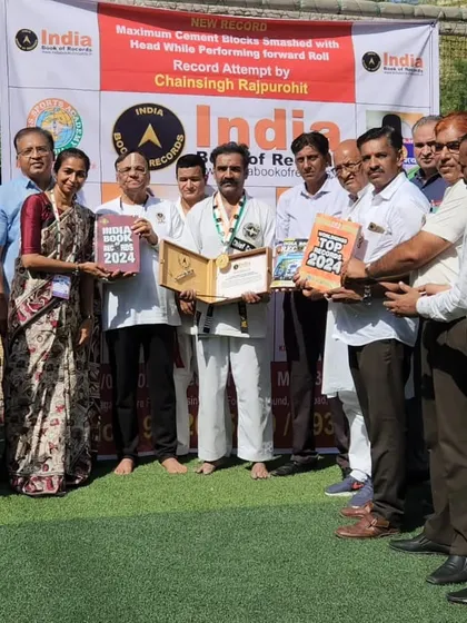 Receiving the official certification from the India Book of Records for my new record. It is an honor to be recognized for my dedication to this art form.