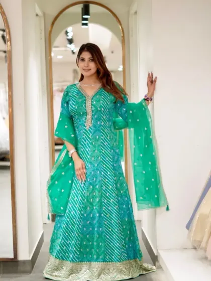 A full view of this gorgeous green bandhani-style Anarkali. The flowing skirt and vibrant color are perfect for a festive day out.