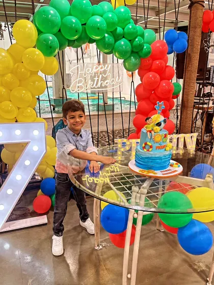 A fun pool party-themed cake for Prishiv's 7th birthday. The bright colors and playful elements like a beach ball and sunglasses make it perfect for a summer celebration.