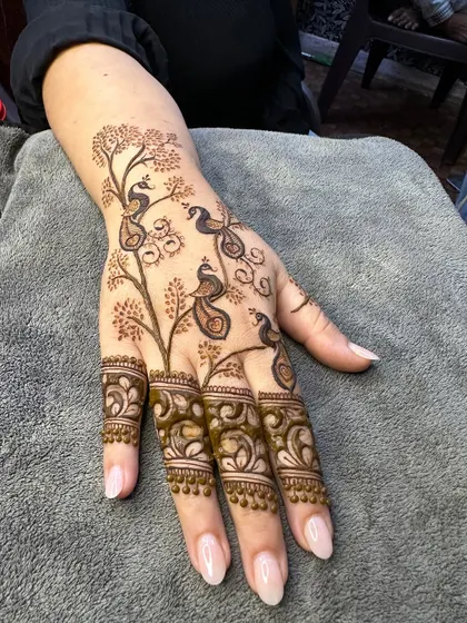 The beautiful peacock tree design, a unique and artistic choice for any henna lover.