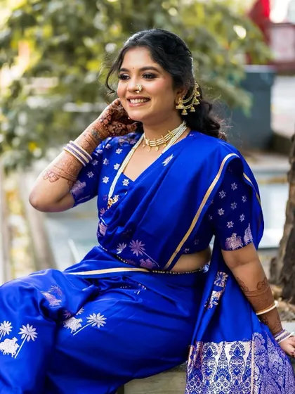 For her engagement, bride Shruti chose this comfortable and stylishly draped blue Nauvari. The dhoti style gives it a modern edge while honoring tradition.