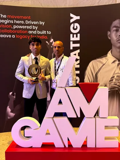 Our athlete and coach stand proudly at the iAMGame Sports Conclave. This event recognizes our commitment to building a legacy of sporting excellence for India.