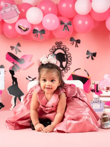 A cute crawling pose that shows off the beautiful details of her birthday dress.