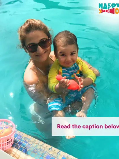 A mother and child enjoying a playful moment by the pool edge during their lesson.