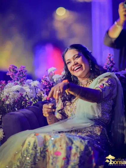 A moment of pure, uninhibited laughter from the bride during her engagement celebration.