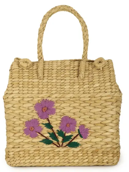 Our charming Kauna grass picnic basket, adorned with purple floral embroidery. Handwoven for durability and style, this eco-friendly basket is perfect for outdoor escapes, adding a touch of handcrafted elegance to your adventures.