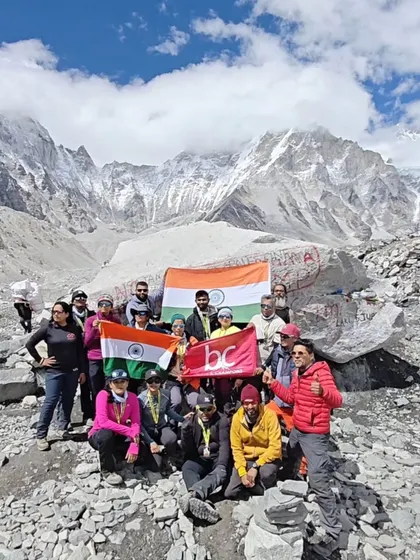 The full team at Everest Base Camp, celebrating a successful season end. The Indian flag is held proudly, marking a moment of national and personal achievement.