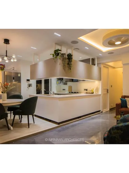 An open kitchen is the social hub of a modern home. In this project, we designed a central island kitchen that seamlessly connects to the dining and living areas, featuring smart storage, premium finishes, and suspended planters for a touch of green.