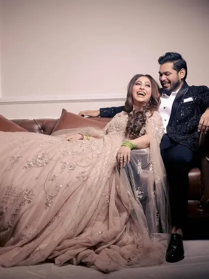 A moment of shared laughter, showing the fun and joy of the engagement celebration.